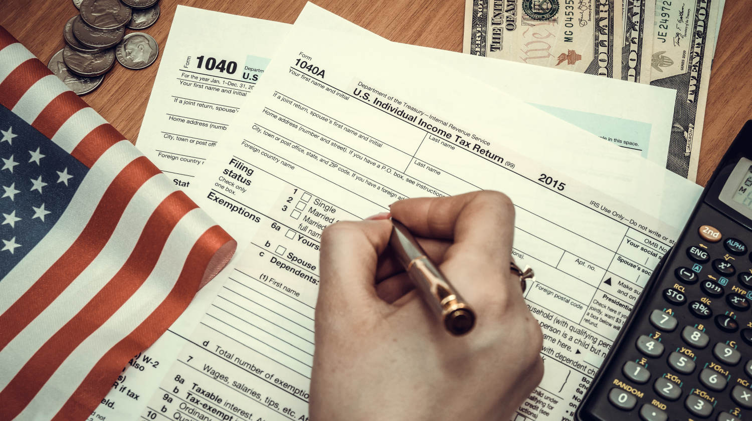 Featured | Business woman fills tax forms | IRS Tax Forms by State | A Comprehensive Guide | taxes