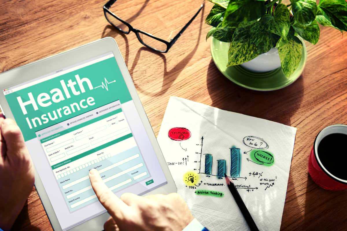 health insurance showing on tablet | The Master List of All Types of Tax Deductions | types of tax deductions | self employment tax deductions