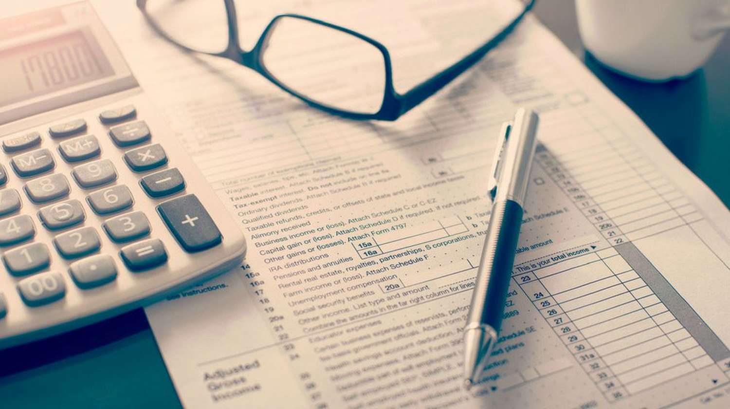 Featured | calculator, glasses, pen, and forms | Return Taxes Frequently Asked Questions | Where Is My Tax Refund?