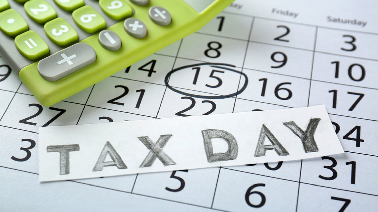 Featured | Card with text TAX DAY and calculator on calendar | What Is The Tax Date And How You Should Prepare
