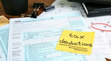 forms and sticky note | Important Deductions On Taxes You Need To Know About | Featured