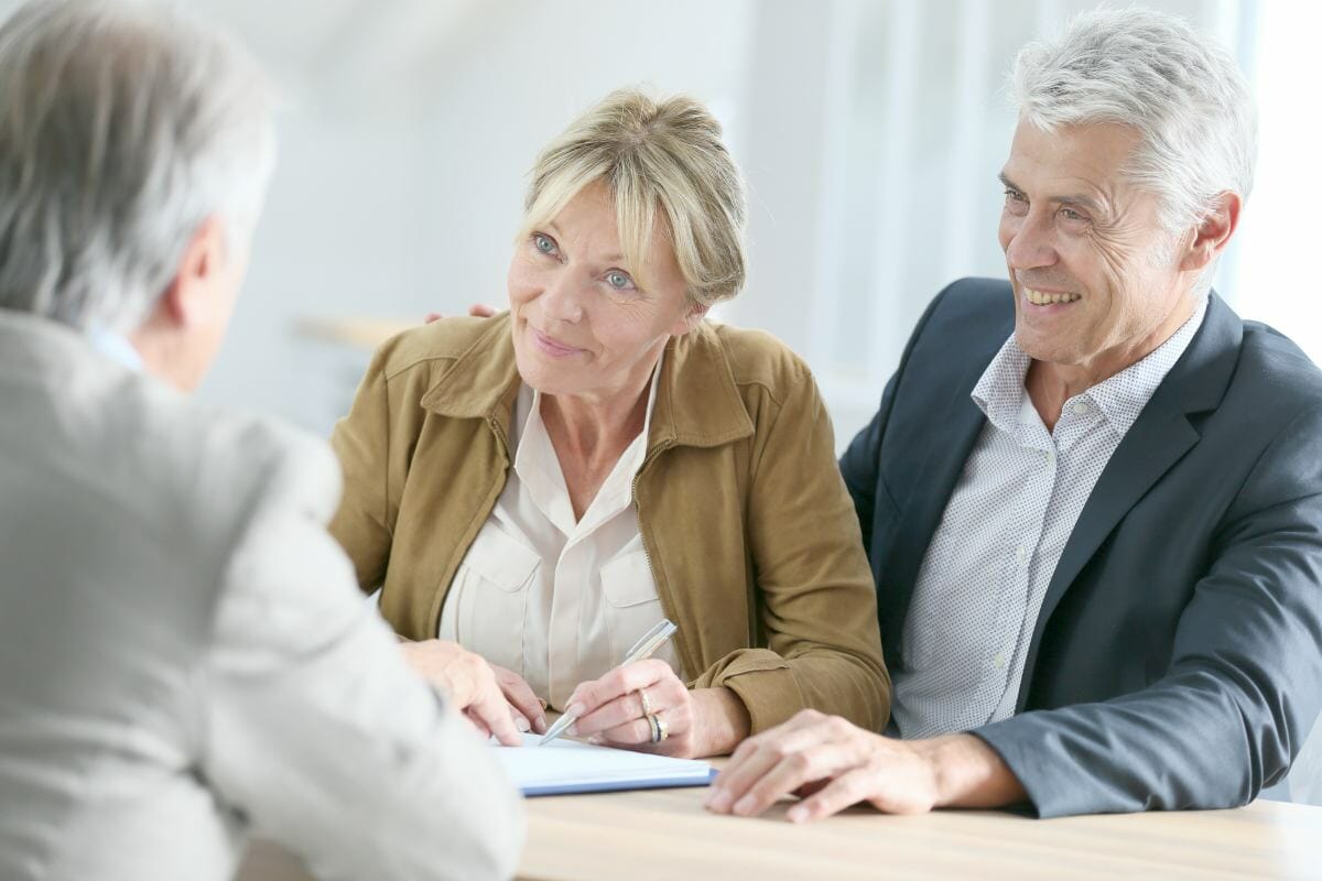 senior couple meeting with real estate agent | Tax Problems? Avoid These Tax Filing Mistakes | estimated tax payments