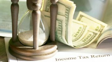 Feature | hourglass and money | Personal Income Tax | A Guide To Doing Your Taxes