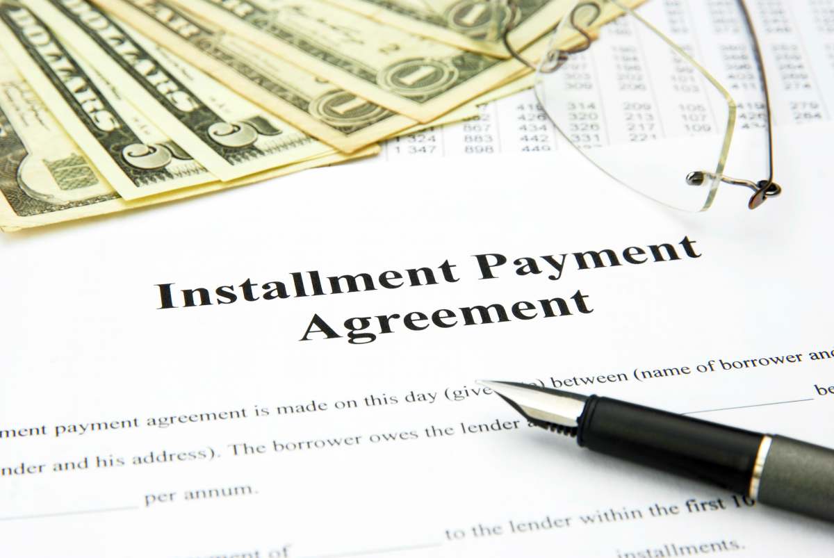 installment payment written on paper | What To Do When You Owe Back Taxes