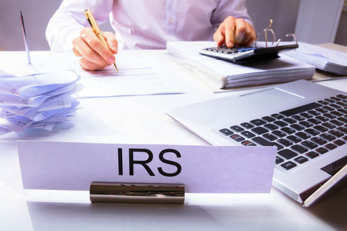 IRS nameplate and accountant | Tax Relief Tips You Can Do When You’re In Tax Trouble | Help with tax problems