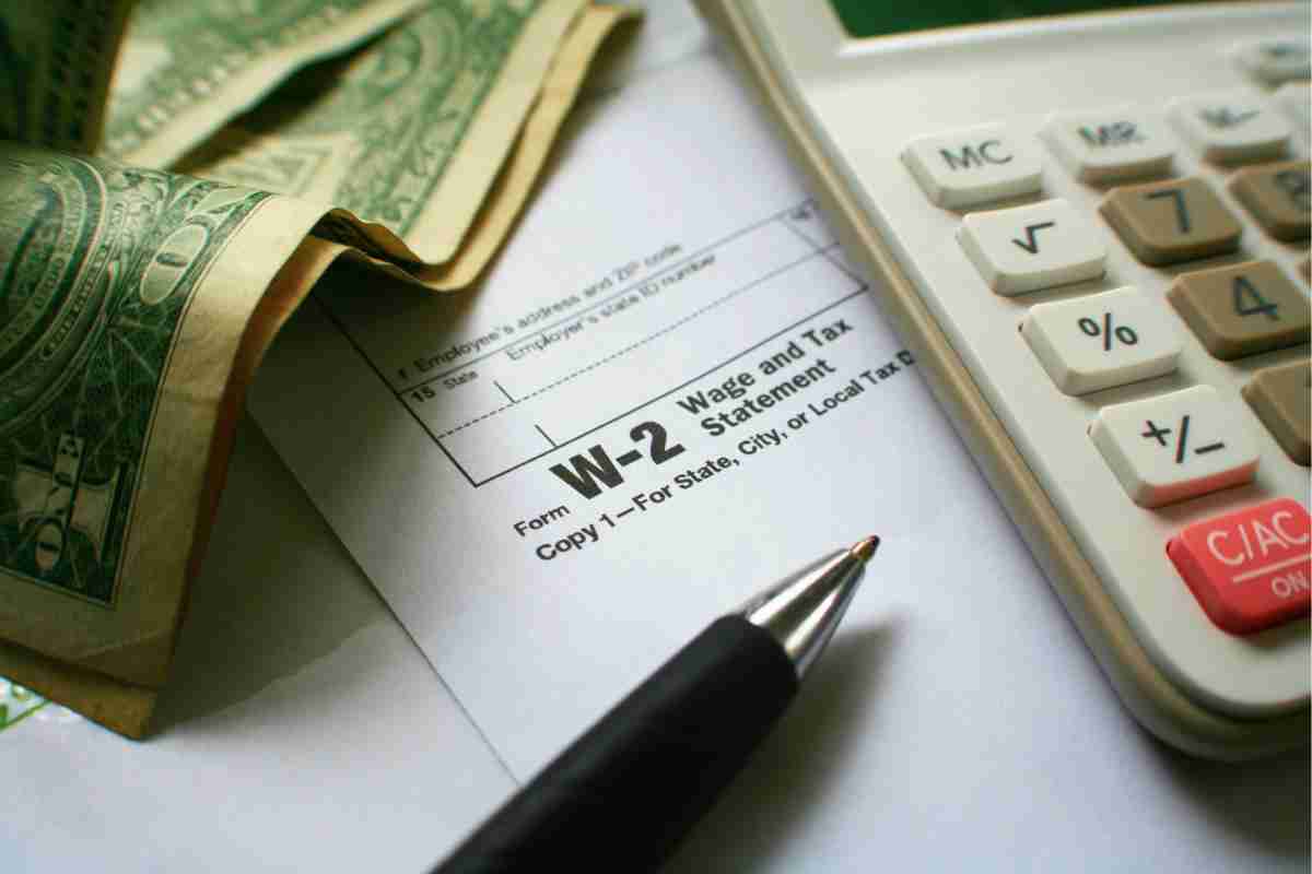 dollar pen paper and calculator on a table | IRS Tax Forms Directory | Comprehensive Tax Forms Guide