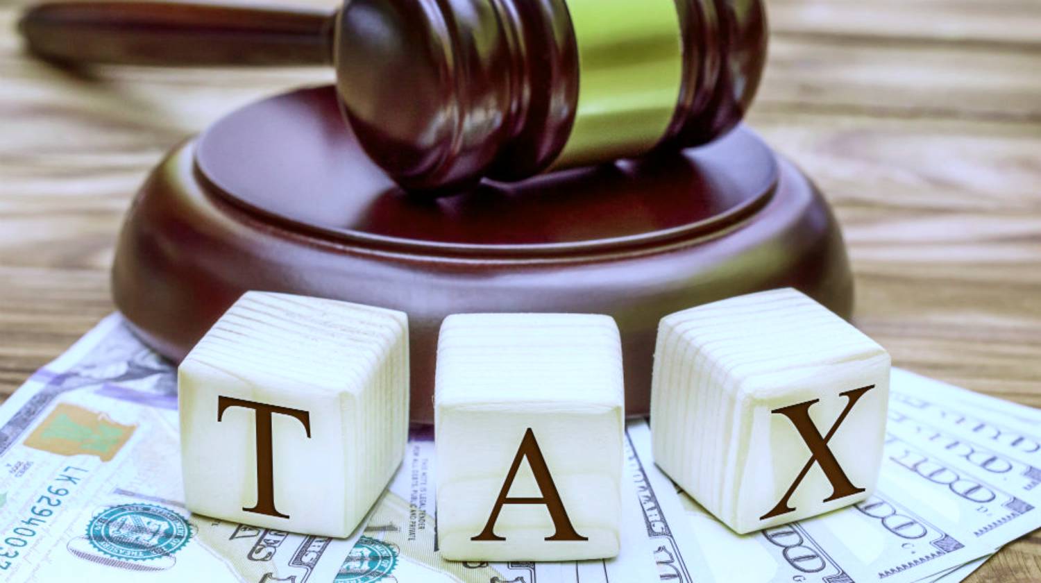 Feature | tax blocks gavel and money | Tax Penalty For Underpayment [2019 Edition] | Tax Relief Center | irs penalty
