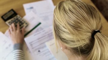 Feature | woman unpaid bills has many debts | Back Taxes: How Much Do I Owe the IRS? | how much do i owe the irs