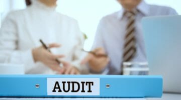 Feature | two auditors meeting | How To Prepare For An IRS Audit | what does being audited mean