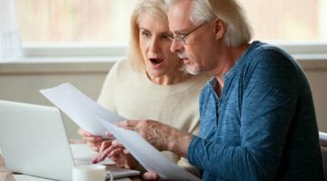 Feature | senior couple worried | What Happens If You Don’t File Your Taxes For 5 Years Or More? | what happens if you don't file taxes