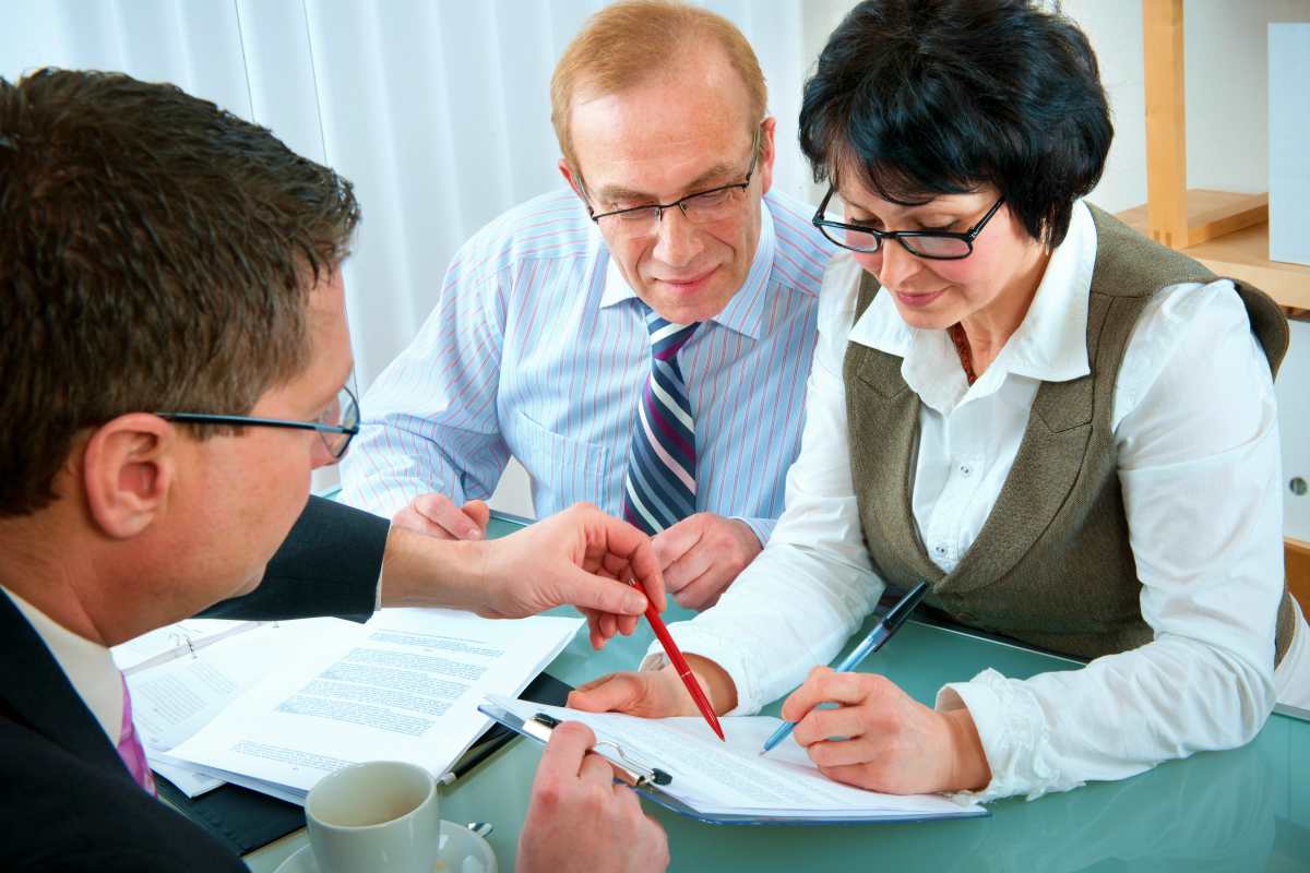couple meeting with agent | Top Reasons To Appeal An IRS Tax Lien And How To Do It | form 12153