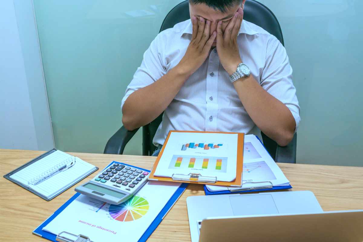 tired man financial problems | Reasons To Speak To A Tax Relief Specialist About Your Back Taxes ASAP | tax specialist