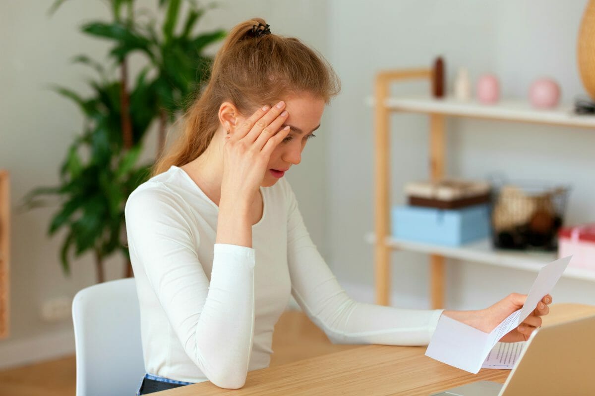 woman worried about tax | Tax Worries You May Have And The Solutions For Each [FAQs]