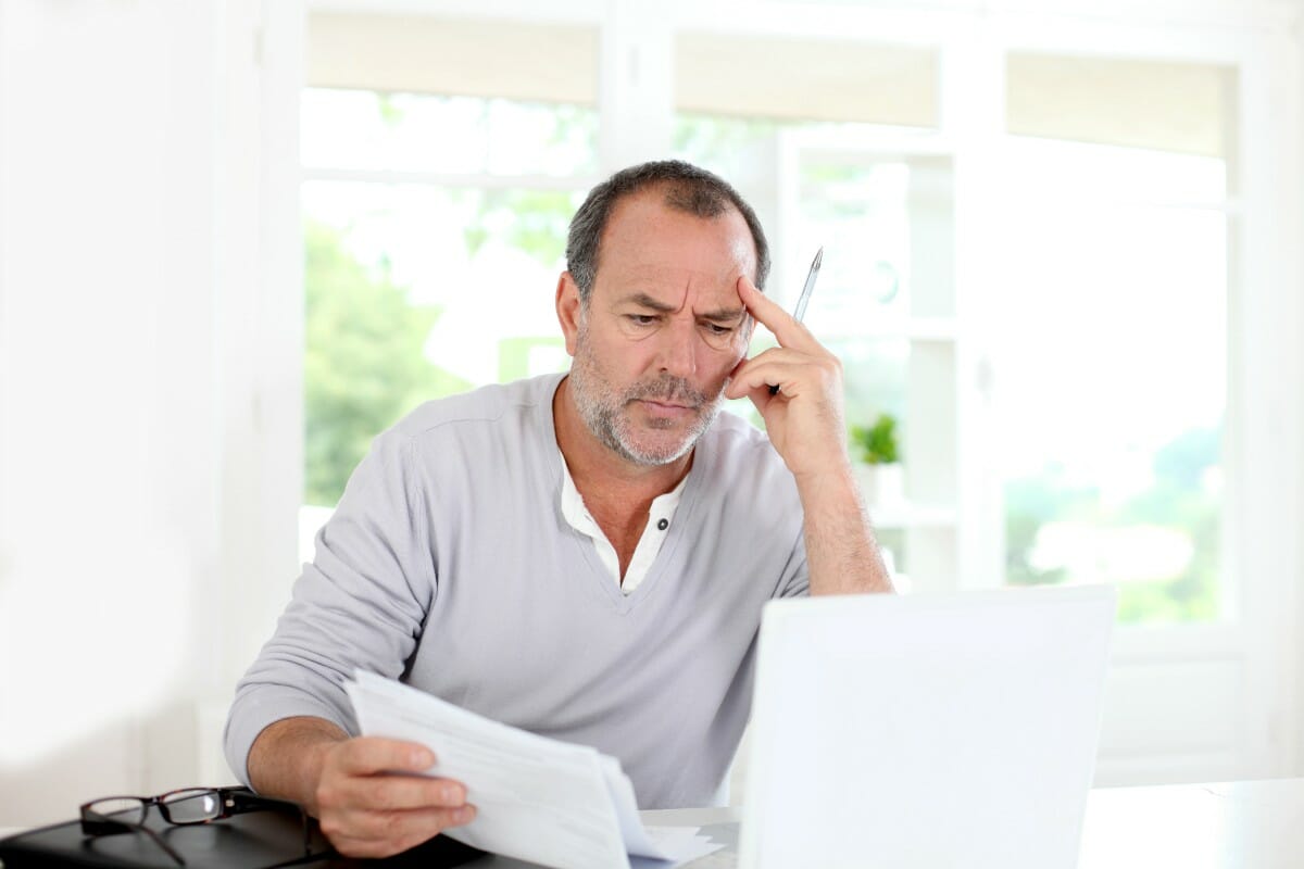 senior man thinking | Tax Records You Should Keep In Your Business To Avoid IRS Audit | tax receipts