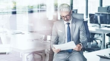 Feature | businessman holding letter | Types Of IRS Audit Letters And What Each Means | irs audit