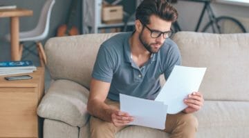 Featured | man reading letter | How To Request IRS Verification Of Non-Filing Letter | irs non-filing letter
