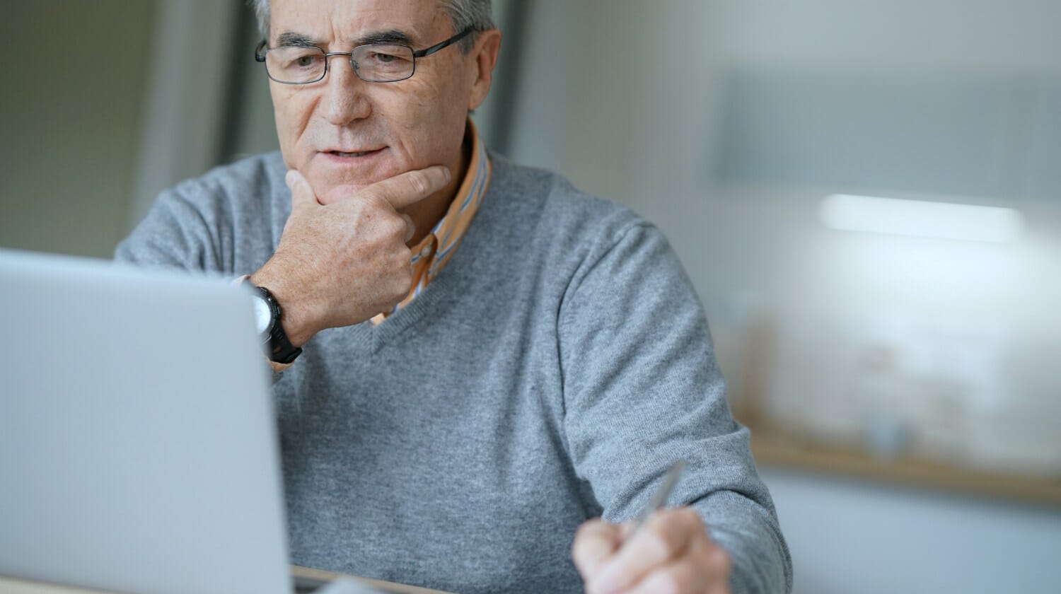 Featured | senior man looking at his laptop | IRS Tax Audit Penalties: Everything You Need To Know | irs tax audit