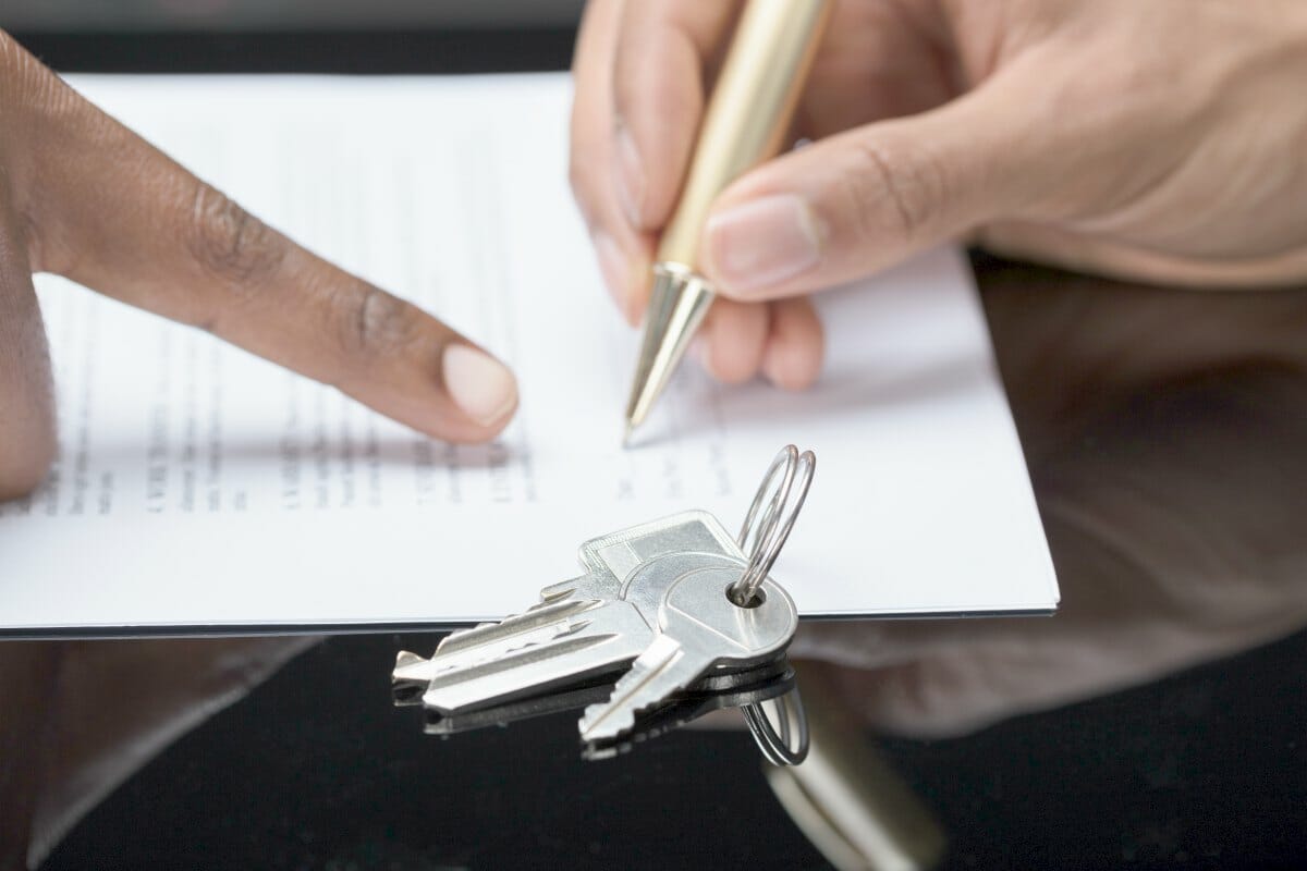 person signing a document | Tax Transcript VS Tax Return: How Do They Differ? | tax transcript | irs tax transcript